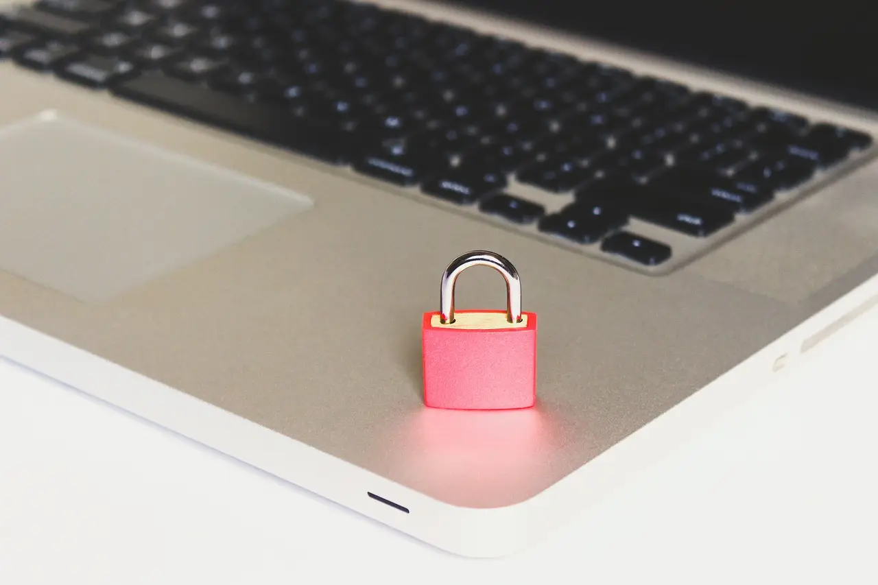 A padlock resting on a laptop keyboard